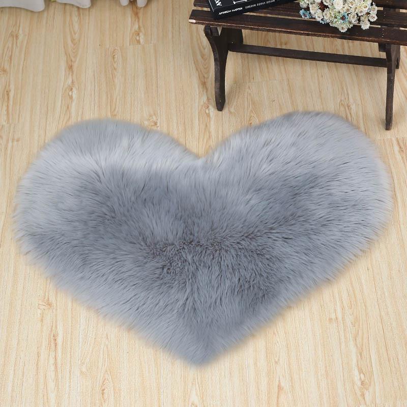 Heart-Shaped Decorative Item Covered In Gray Faux Fur #595
